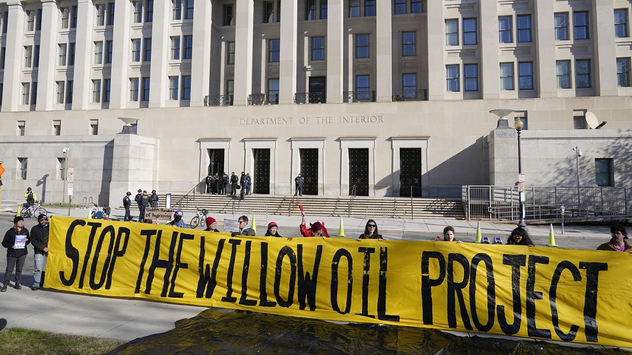 Demonstrators protest against the Biden administration's approval of the Willow oil-drilling project before a scheduled speech by Biden at the Department of the Interior in Washington, March 21, 2023. (AP Photo/Patrick Semansky, File) 