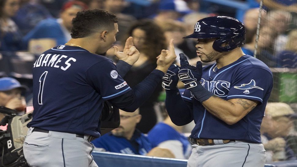 Tampa Bay Rays' Tommy Pham, right, is greeted by Willy Adames (1) after he hit a two-run home run against the Toronto Blue Jays in the third inning of a baseball game in Toronto on Friday night (AP Photo)