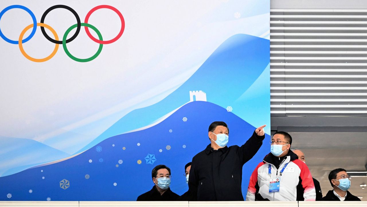 In this photo released by China's Xinhua News Agency, Chinese President Xi Jinping tours the National Speed Skating Oval, a competition venue for the 2022 Winter Olympics, in Beijing on Tuesday. (Shen Hong/Xinhua via AP)