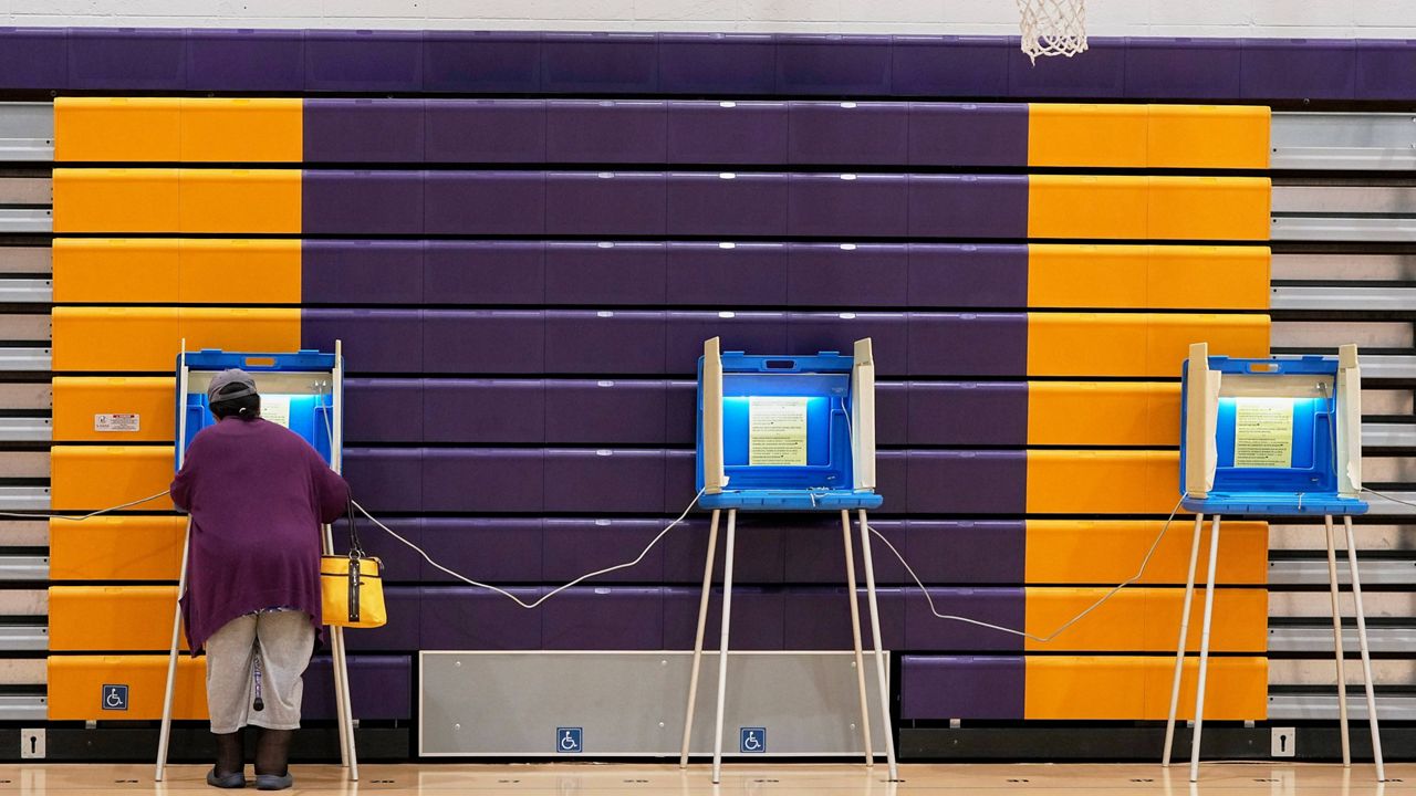 A woman casts her ballot, Tuesday, Nov. 5, 2024, in Milwaukee, Wis.