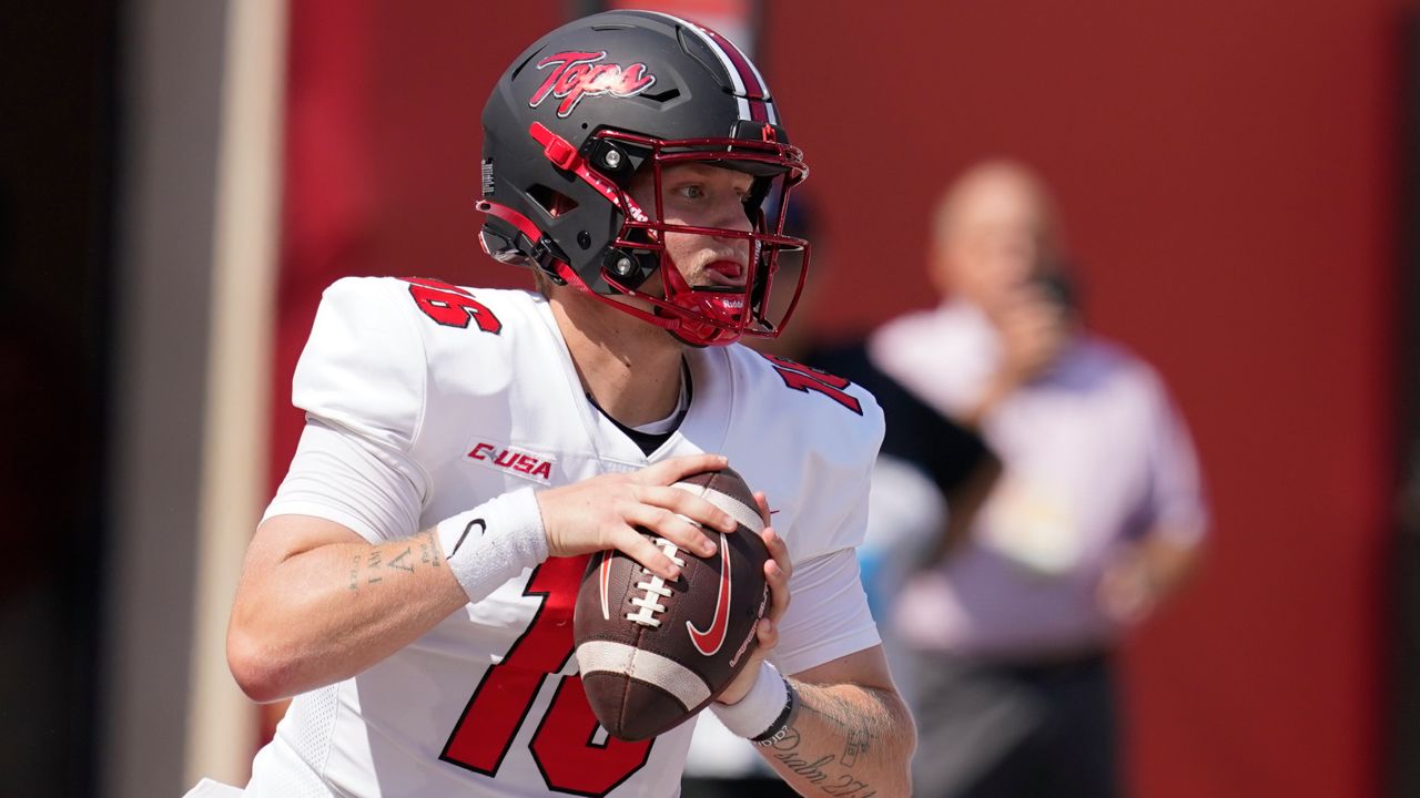 WKU quarterback Austin Reed completed 29 of 35 passes and led the Hilltoppers on four straight scoring drives in the first half against FIU. (AP Photo/Darron Cummings)