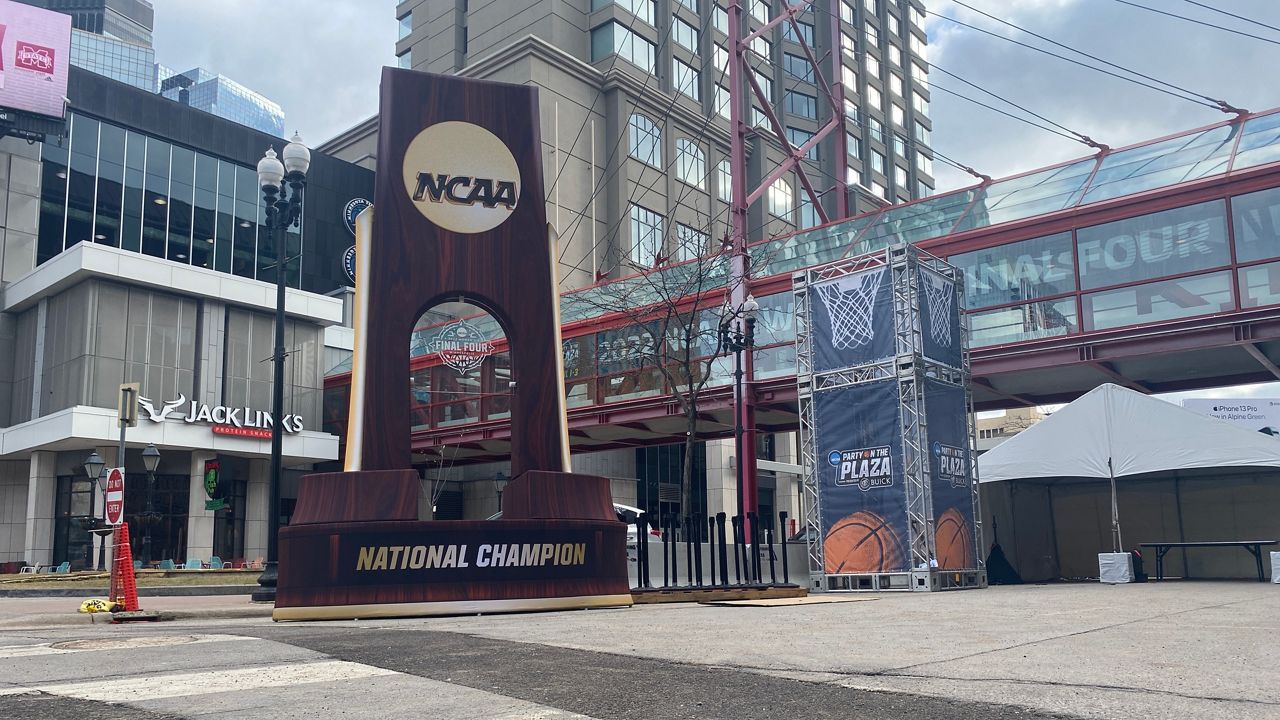 A National Championship replica trophy sits outside the Target Center in Minneapolis. (Spectrum News 1/Erin Wilson)