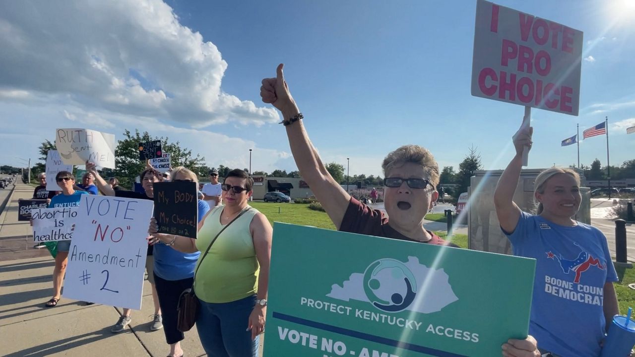 Women rally in Louisville, push for change