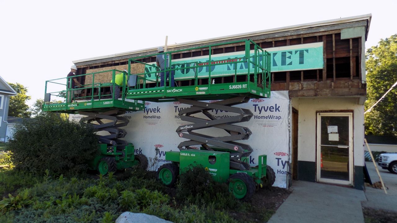 Historic Woodman’s sign unveiled amid Janesville renovation