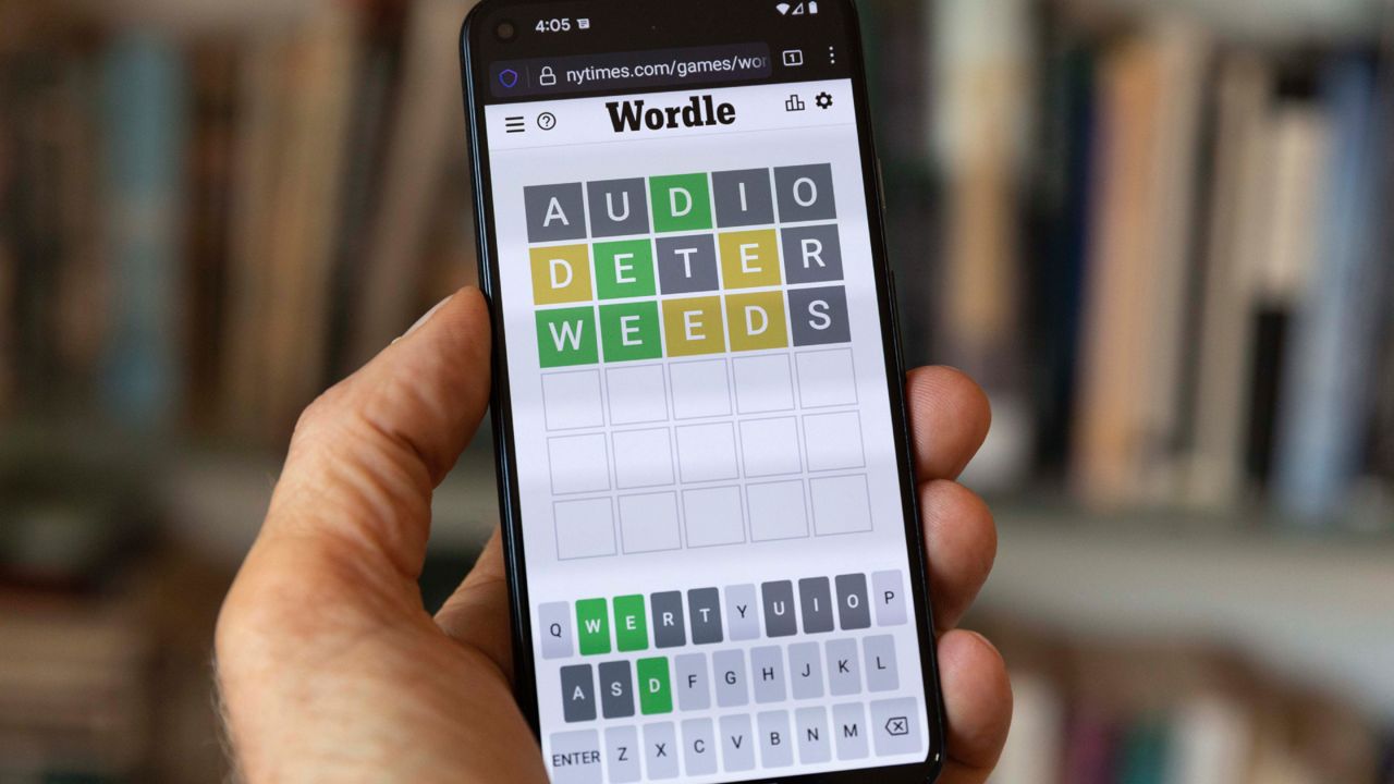 A Wordle game is seen on a mobile phone, Friday, July 15, 2022, in Boston. Hasbro Inc. and The New York Times, which owns Wordle, announced Thursday that Wordle: The Party Game will be available for purchase in North America in October. (AP Photo/Michael Dwyer)