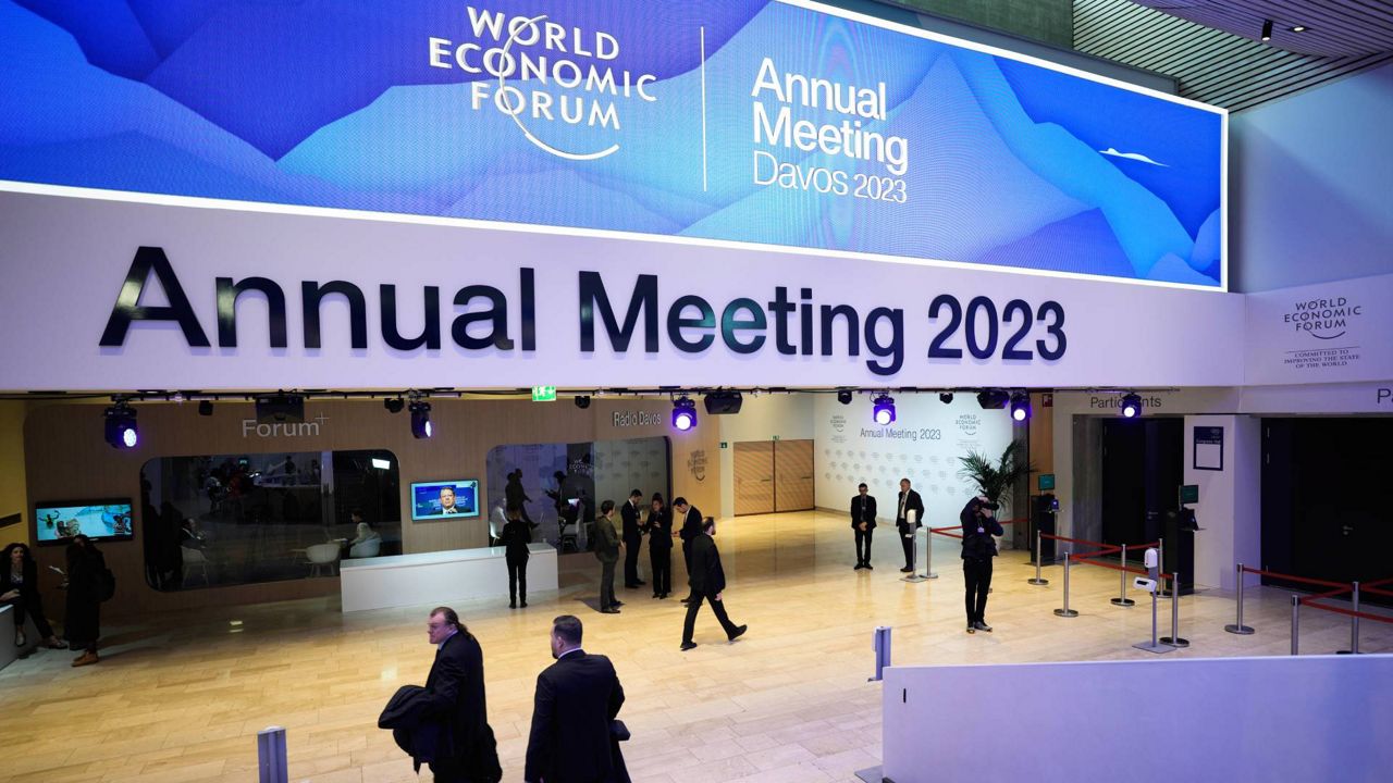People gather in the Davos Congress Center prior to the start of the World Economic Forum in Davos, Switzerland, on Monday. (AP Photo/Markus Schreiber)