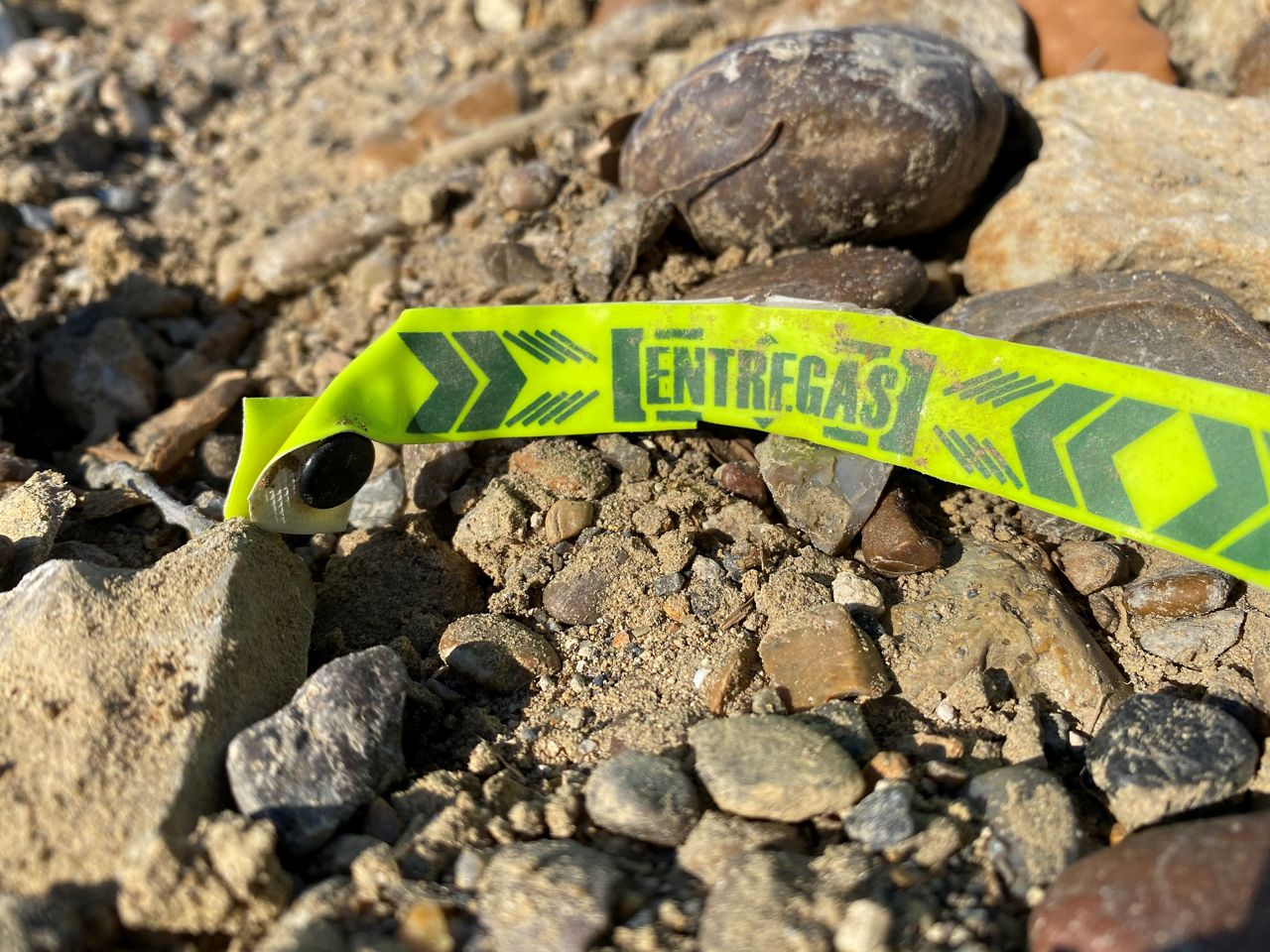 A discarded wristband appears along the U.S.-Mexico border in this image from May 2021. (Spectrum News 1/Adolfo Muniz)