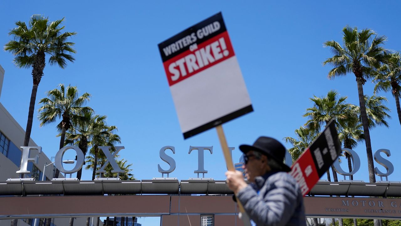 Members of The Writers Guild of America picket outside Fox Studios, Tuesday, May 2, 2023, in Los Angeles. (AP Photo/Ashley Landis)
