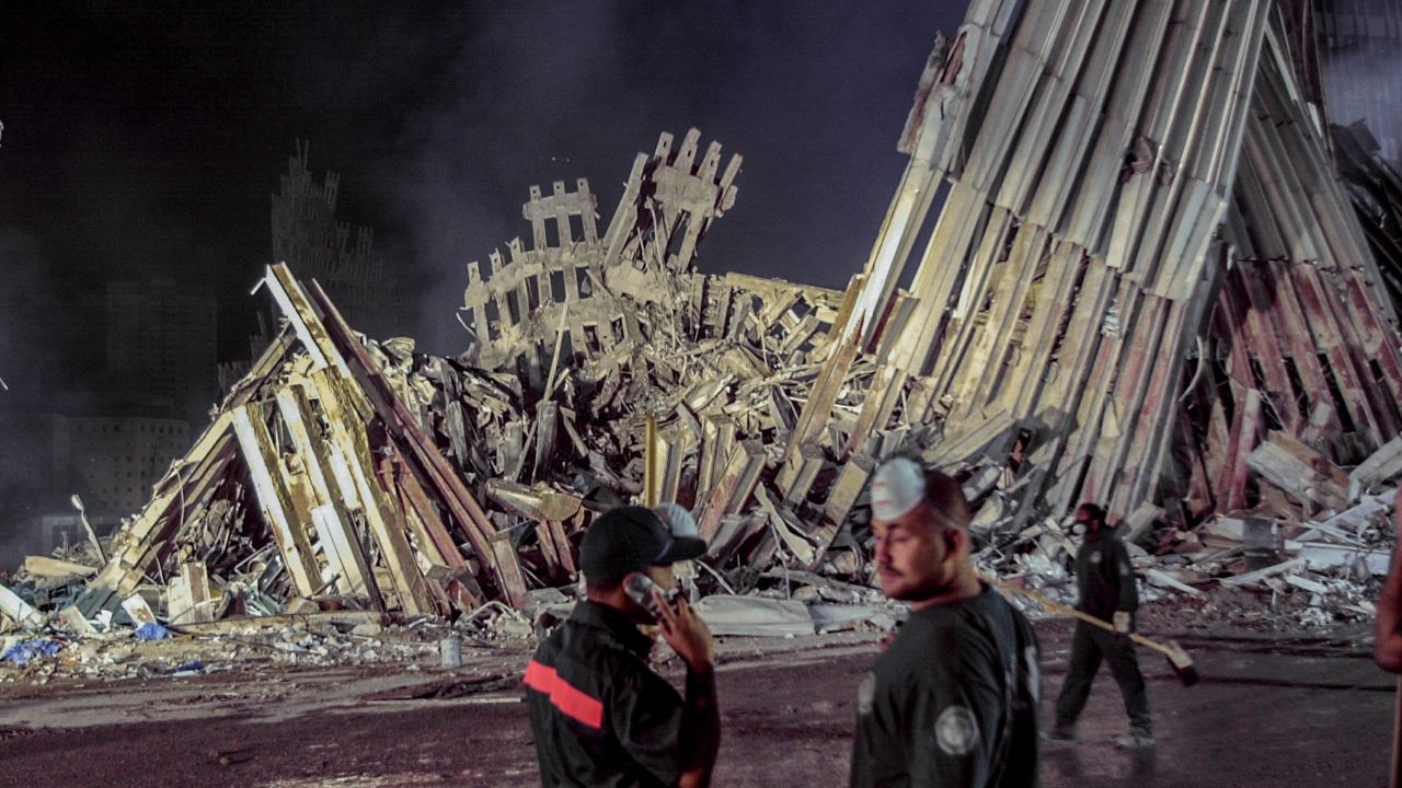 Workers stand in front of ground zero after the Sept.11 attacks in New York