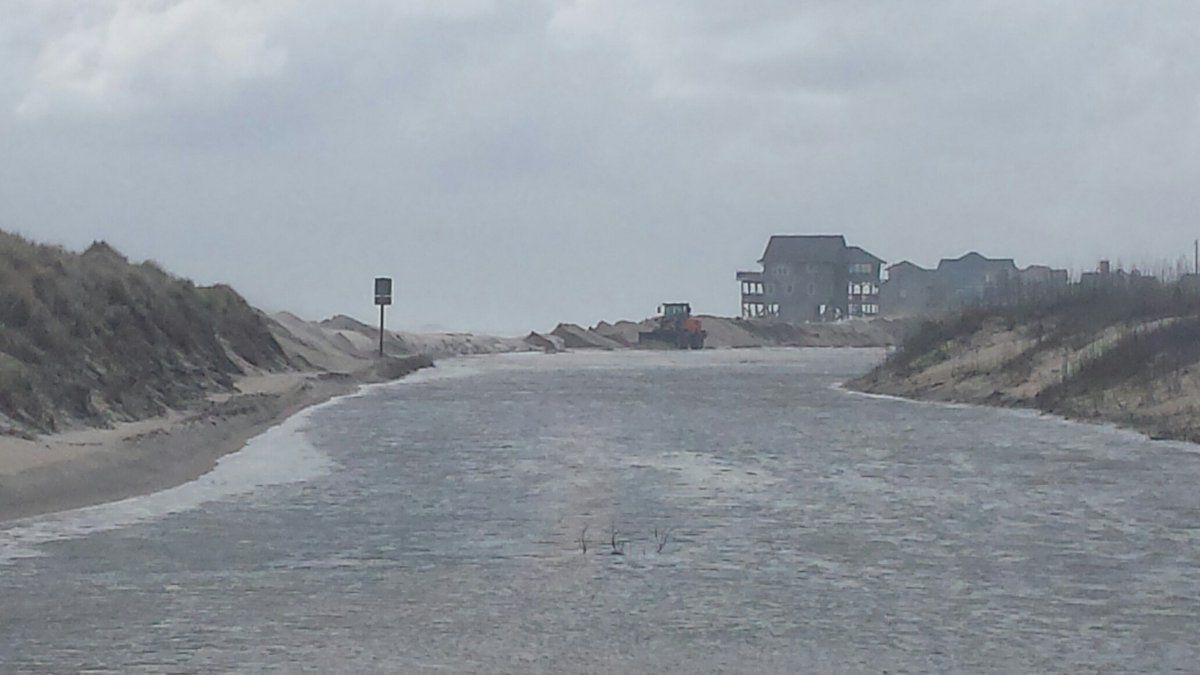 Ocean overwash along Highway 12 at the Outer Banks.  NCDOT photo.