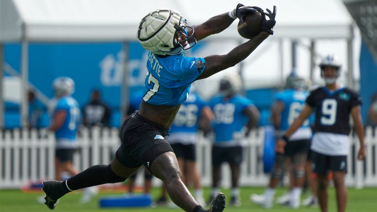 Carolina Panthers receiver Xavier Legette reaches for a catch during the NFL football team's training camp in Charlotte, N.C., Wednesday, July 24, 2024. (AP Photo/Chuck Burton)