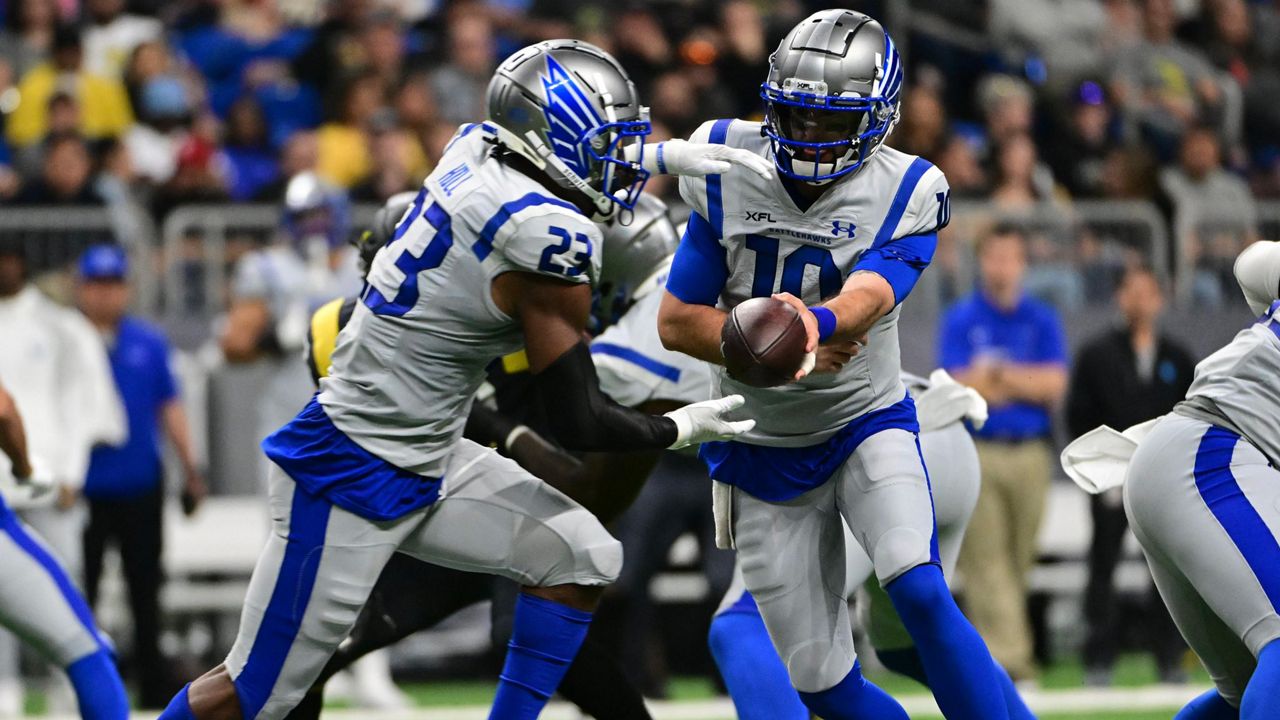 Battlehawks quarterback AJ McCarron hands the ball off to running back Brian Hill in an XFL matchup earlier this season (Courtesy: XFL)