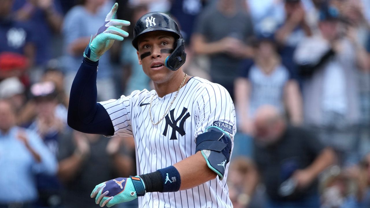 New York Yankees' Aaron Judge reacts after hitting a home run during the fourth inning of a baseball game against the Cleveland Guardians, Thursday, Aug. 22, 2024, in New York.