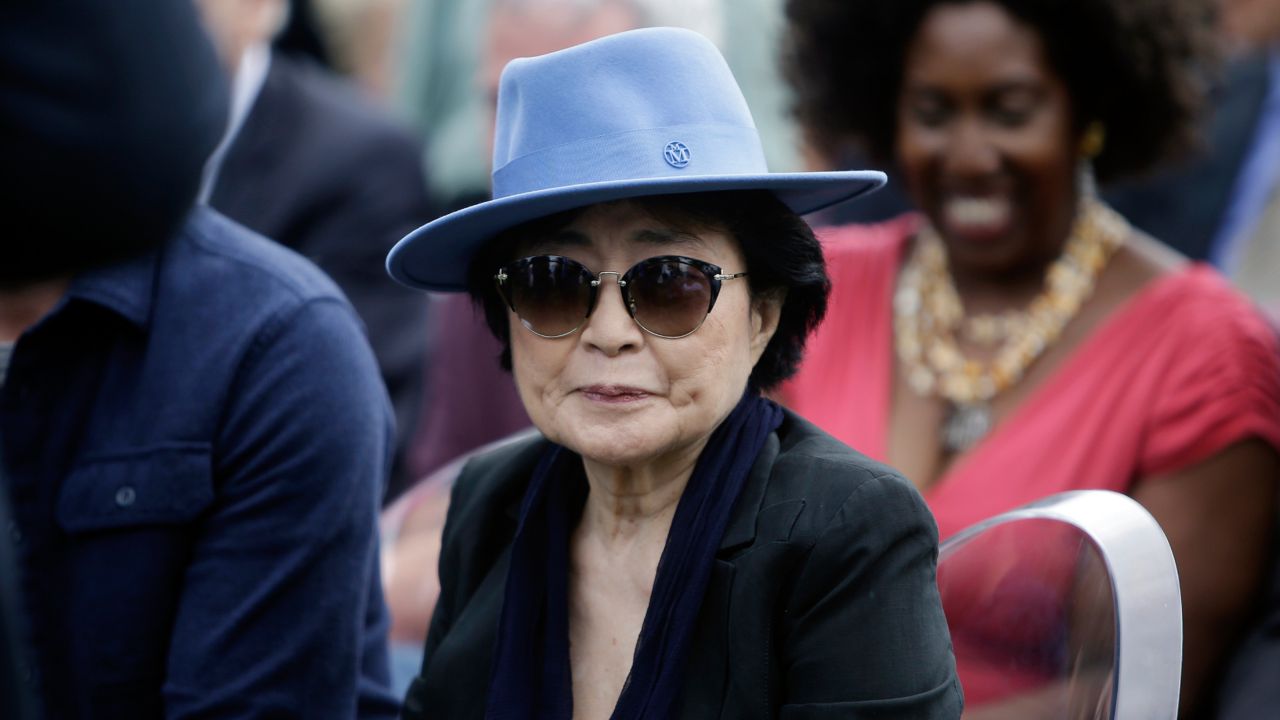 Yoko Ono appears before the dedication ceremony for her permanent art installation, a sculpture called SKYLANDING, at Jackson Park, Oct. 17, 2016, in Chicago. (AP Photo/Kiichiro Sato)