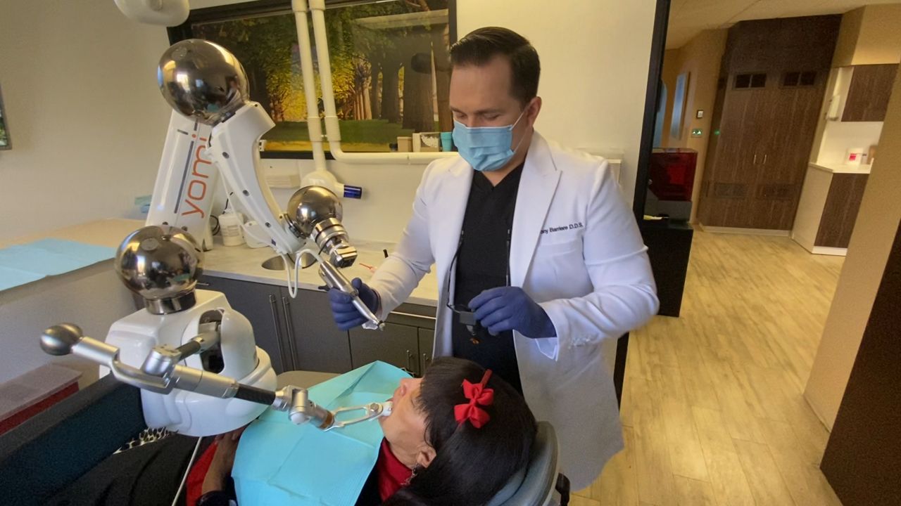 Dentist 1st in LA to use Yomi robot for implants