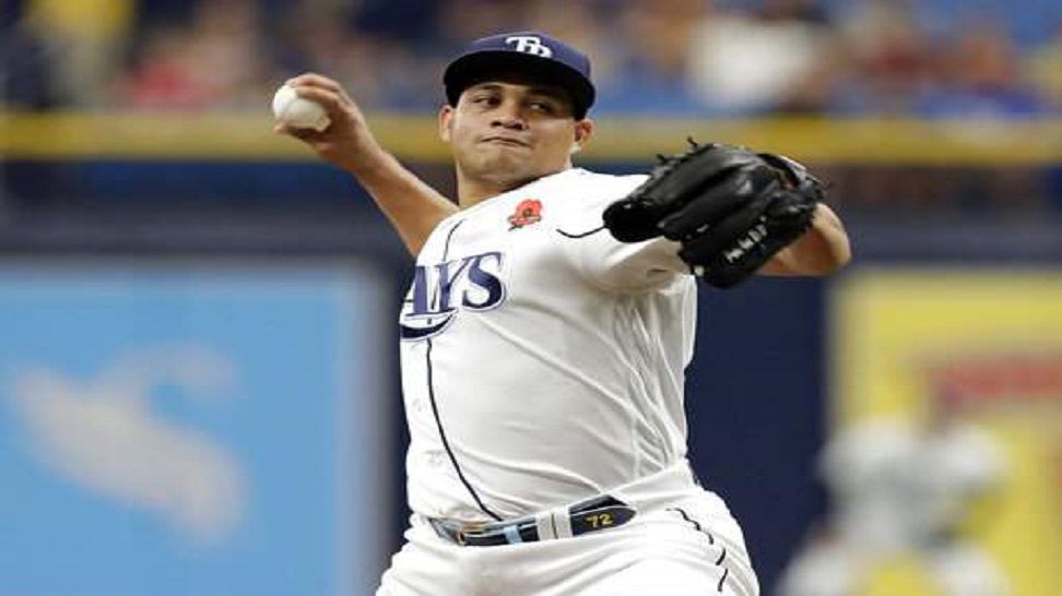 Rays pitcher Yonny Chirinos pitches in the second inning of Tampa Bay's 8-5 victory over Kansas City.  Chirinos improved to 4-0 this season, pitching 5 2/3 innings and allowing two earned runs in relief of opener Ryne Stanek.  (AP Photo/Orlin Wagner)