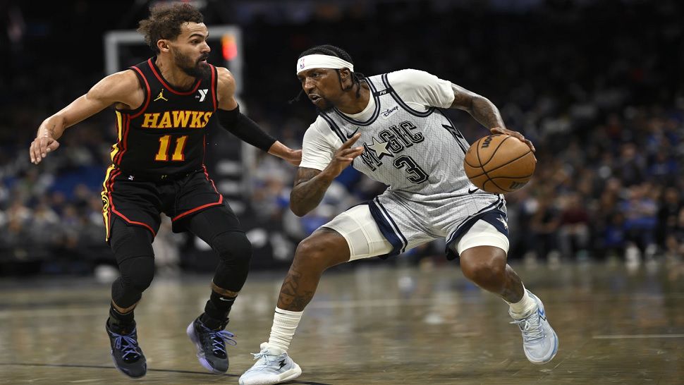 Orlando Magic guard Kentavious Caldwell-Pope (3) is defended by Atlanta Hawks guard Trae Young (11) during the second half of an NBA basketball game, Monday, Feb. 10, 2025, in Orlando, Fla. (AP Photo/Phelan M. Ebenhack)