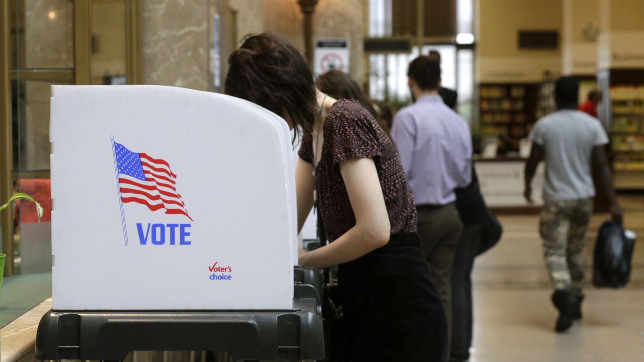 FILE - People cast their votes at a polling station (AP Photo/Patrick Semansky)