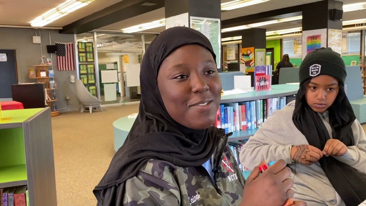 Zainab Saley and other Muslim students at Jackson Middle School in Greensboro, who are fasting to observe the Muslim holy month of Ramadan, gather in the media center during lunch. (Spectrum News 1/Kaye Paddyfote)