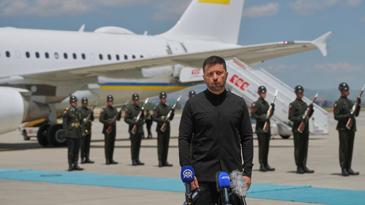 Ukrainian President Volodymyr Zelenskyy talks to journalists as he arrives at Esenboga airport in Ankara, Turkey, Thursday, May 15, 2025. (AP Photo/Evgeniy Maloletka)