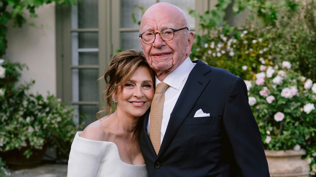 This image provided by News Corp. shows Rupert Murdoch and Elena Zhukova posing for a photo Saturday during their wedding ceremony at his vineyard estate in Bel Air, Calif. (News Corp.  via AP)