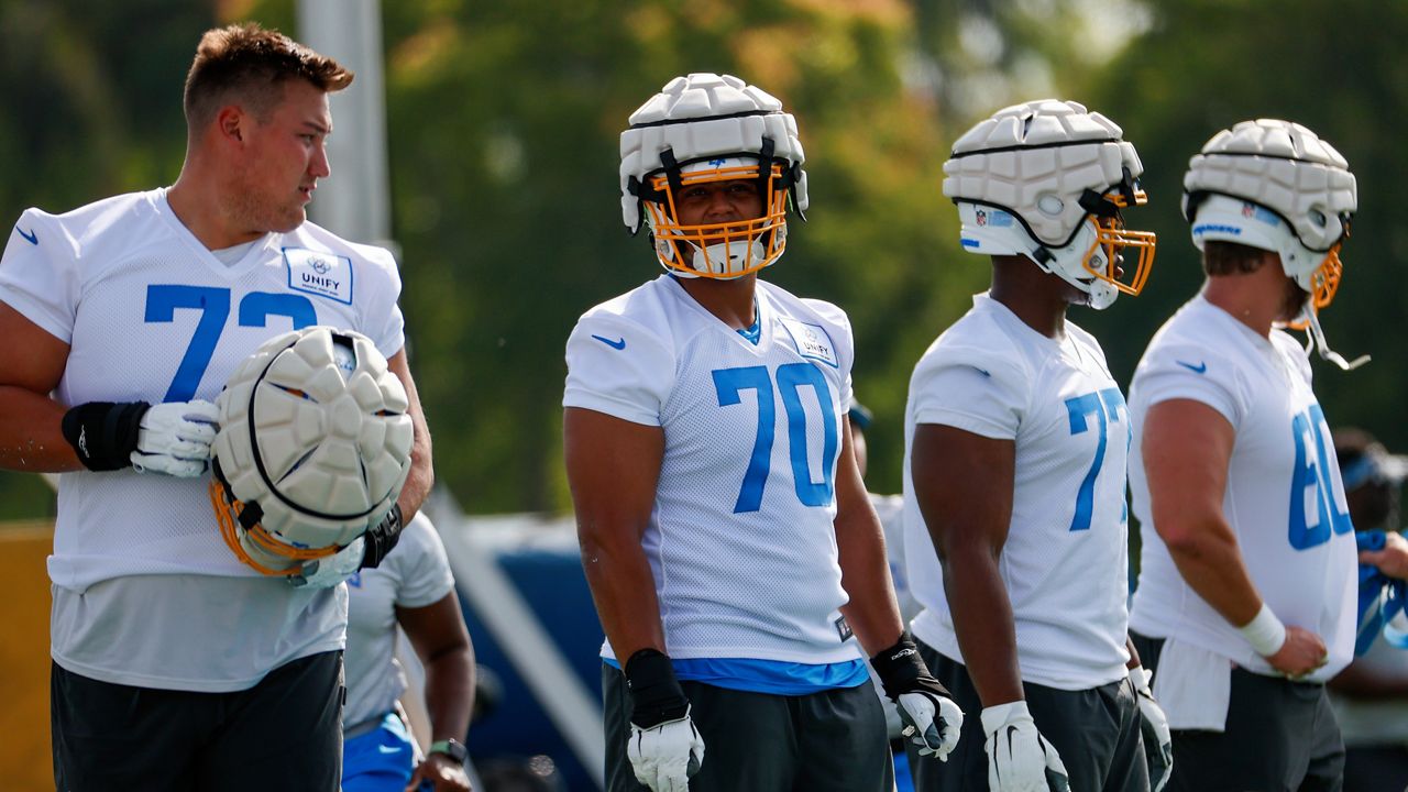 Los Angeles Chargers offensive tackle Foster Sarell (73), offensive tackle Rashawn Slater (70) offensive lineman Zion Johnson (77) and center Isaac Weaver (60) participate in a practice at the NFL football team's training camp, Wednesday, July 27, 2022, in Costa Mesa, Calif. (AP Photo/Ringo H.W. Chiu)