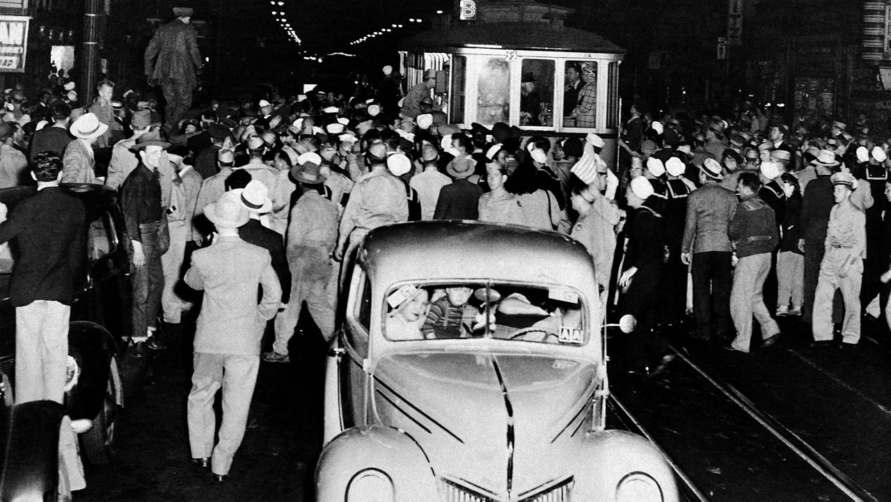 Soldiers, sailors and marines who roamed the street of Los Angeles, June 7, 1943, looking for hoodlums in zoot suits, stopped this streetcar during their search. (AP Photo)