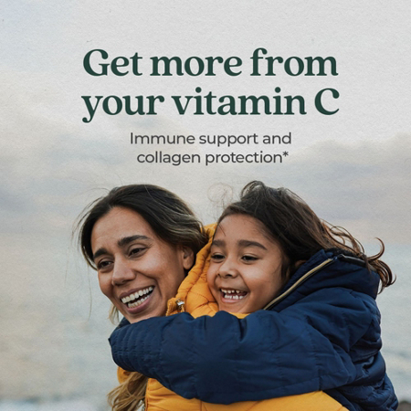 Smiling woman and child in winter coats with vitamin C text