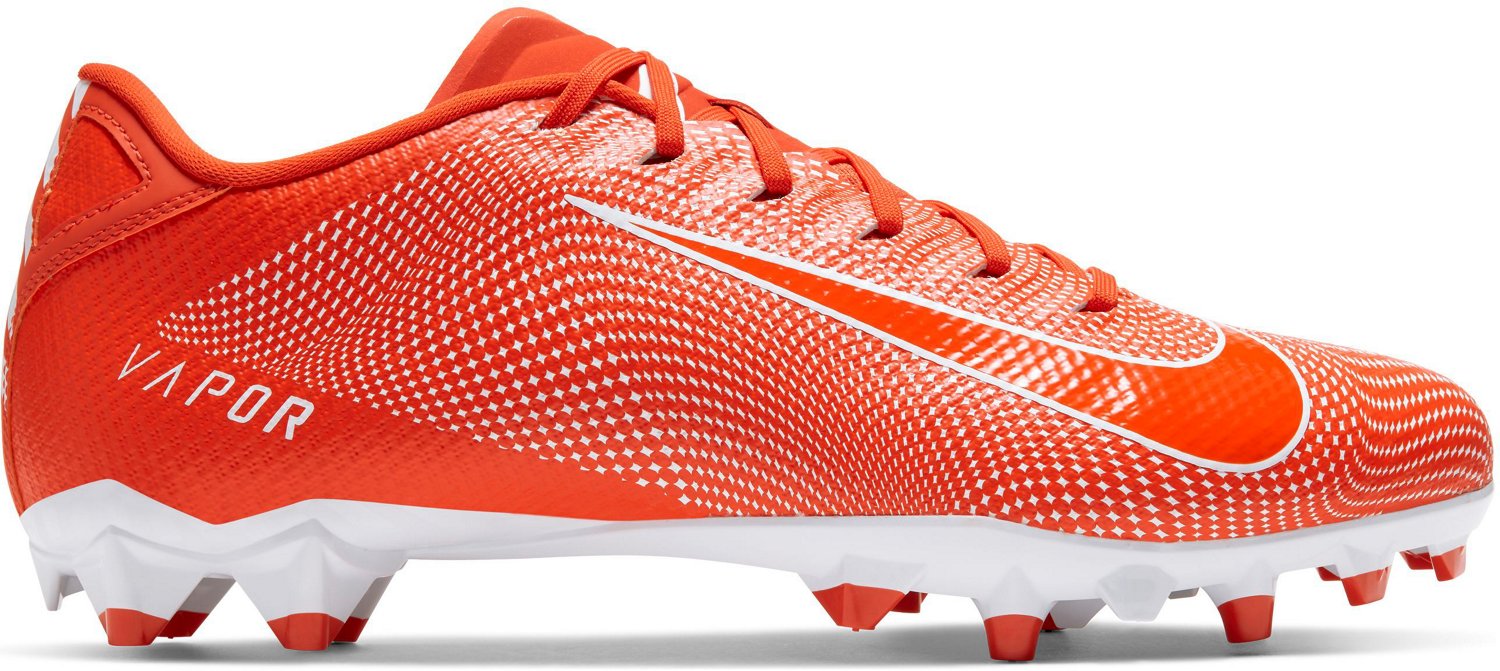 orange and white cleats