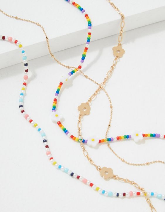 Emballage de quatre colliers ras du cou à perles arc-en-ciel et marguerite Fierté AEO