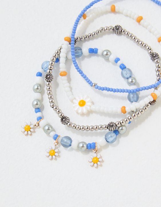 Emballage de quatre bracelets perlés bleus et marguerite AEO