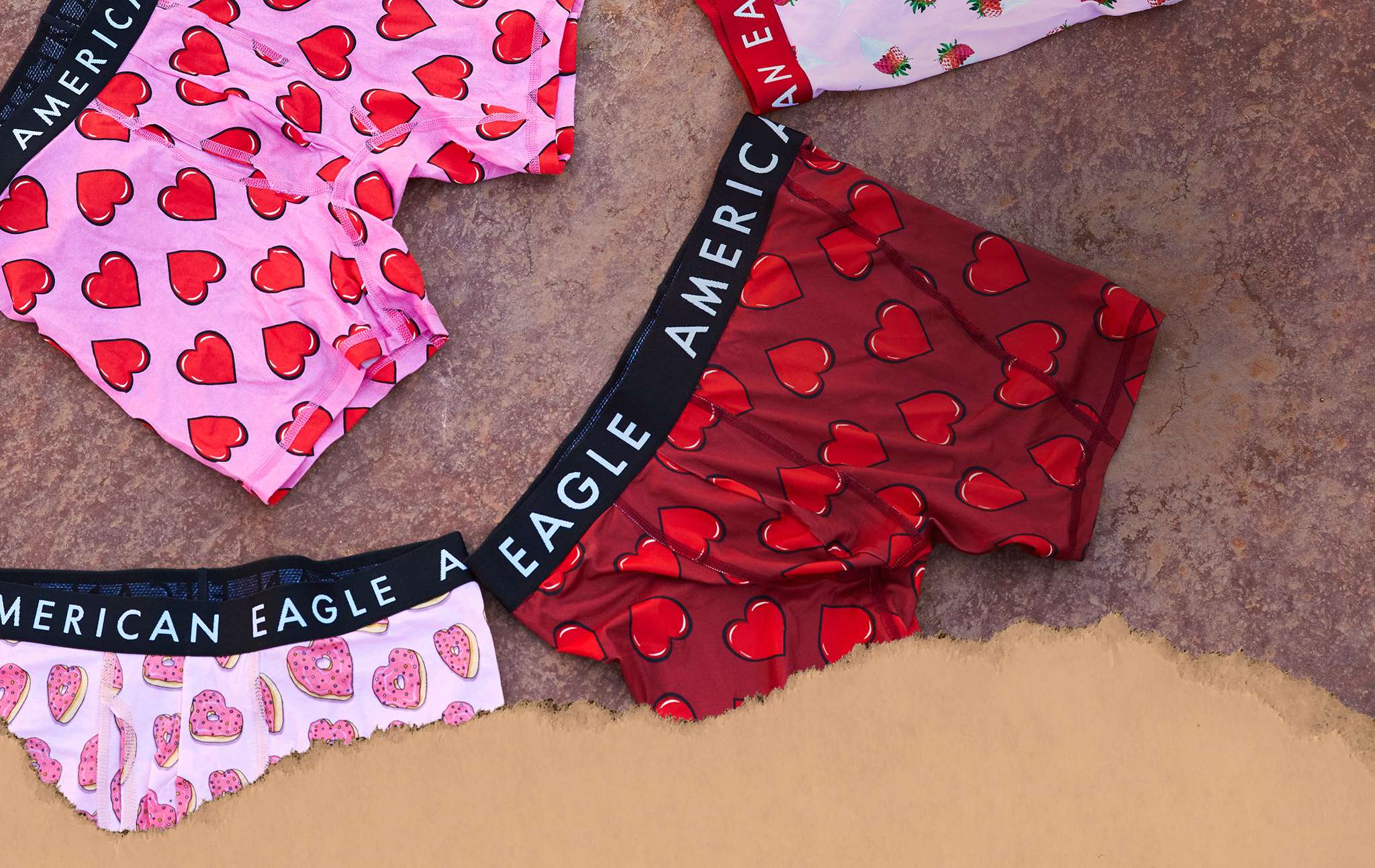 men's underwear covered in pink and red hearts