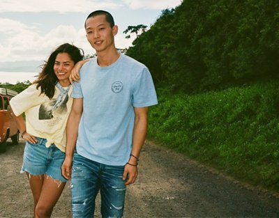 two people wearing AE Real Good clothing in front of mountain in Hawaii