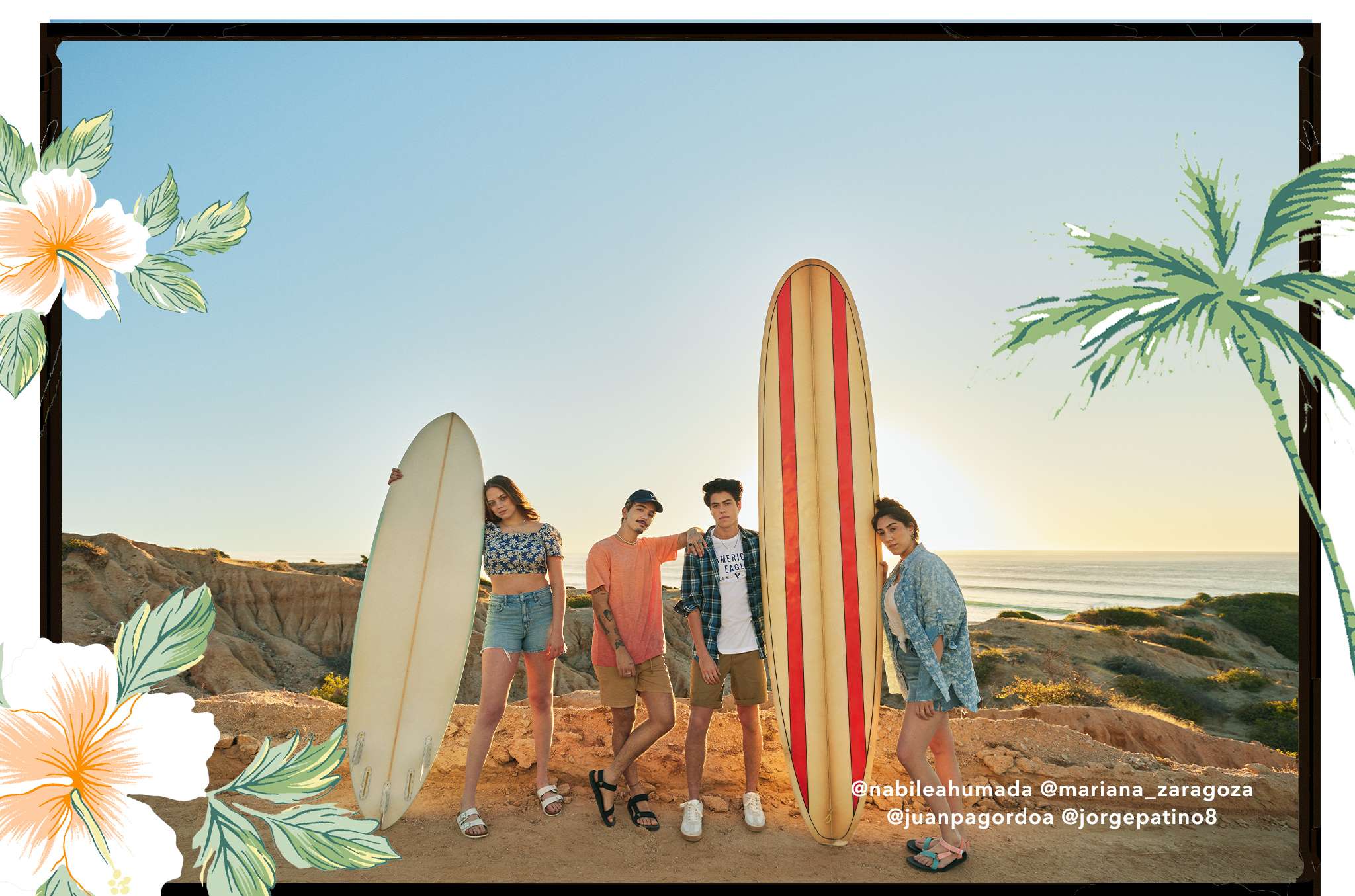 4 teens standing on beach next to surf board