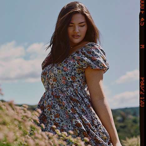 woman in field wearing floral AE dress