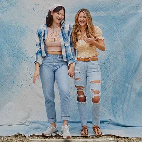 two women wearing AE jeans