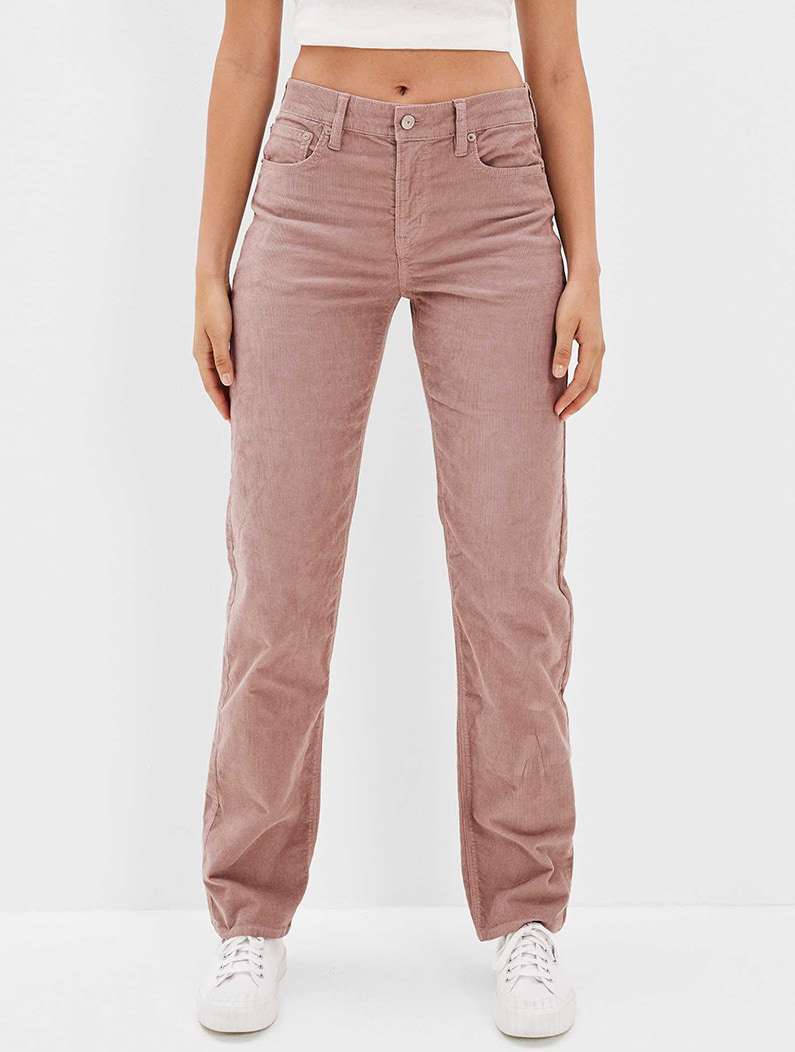 model in mauve pink cord pants