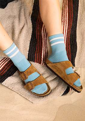 Blue boyfriend socks in brown seude slides 