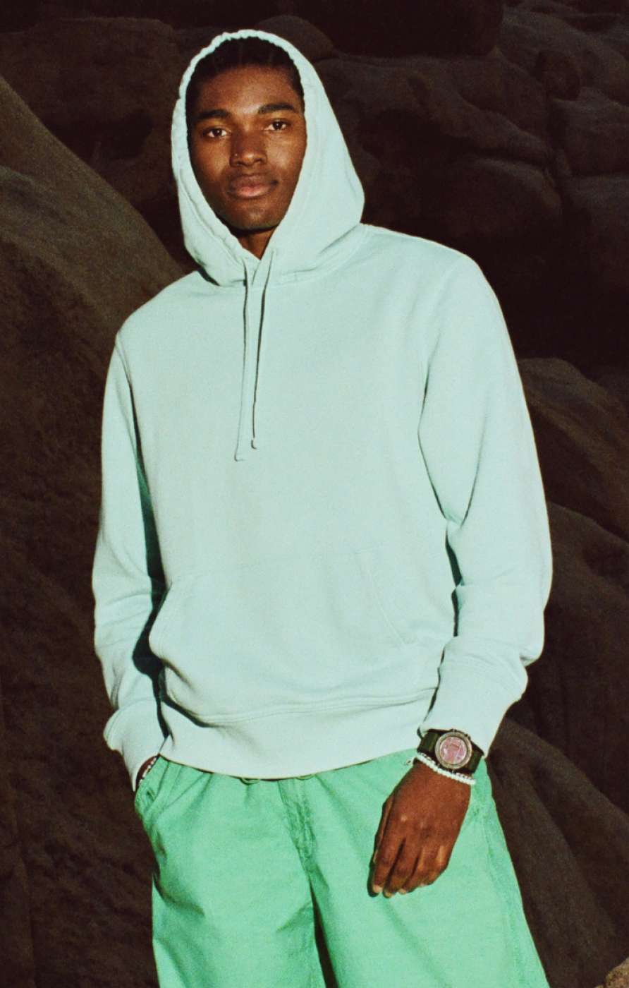 model in green hoodie