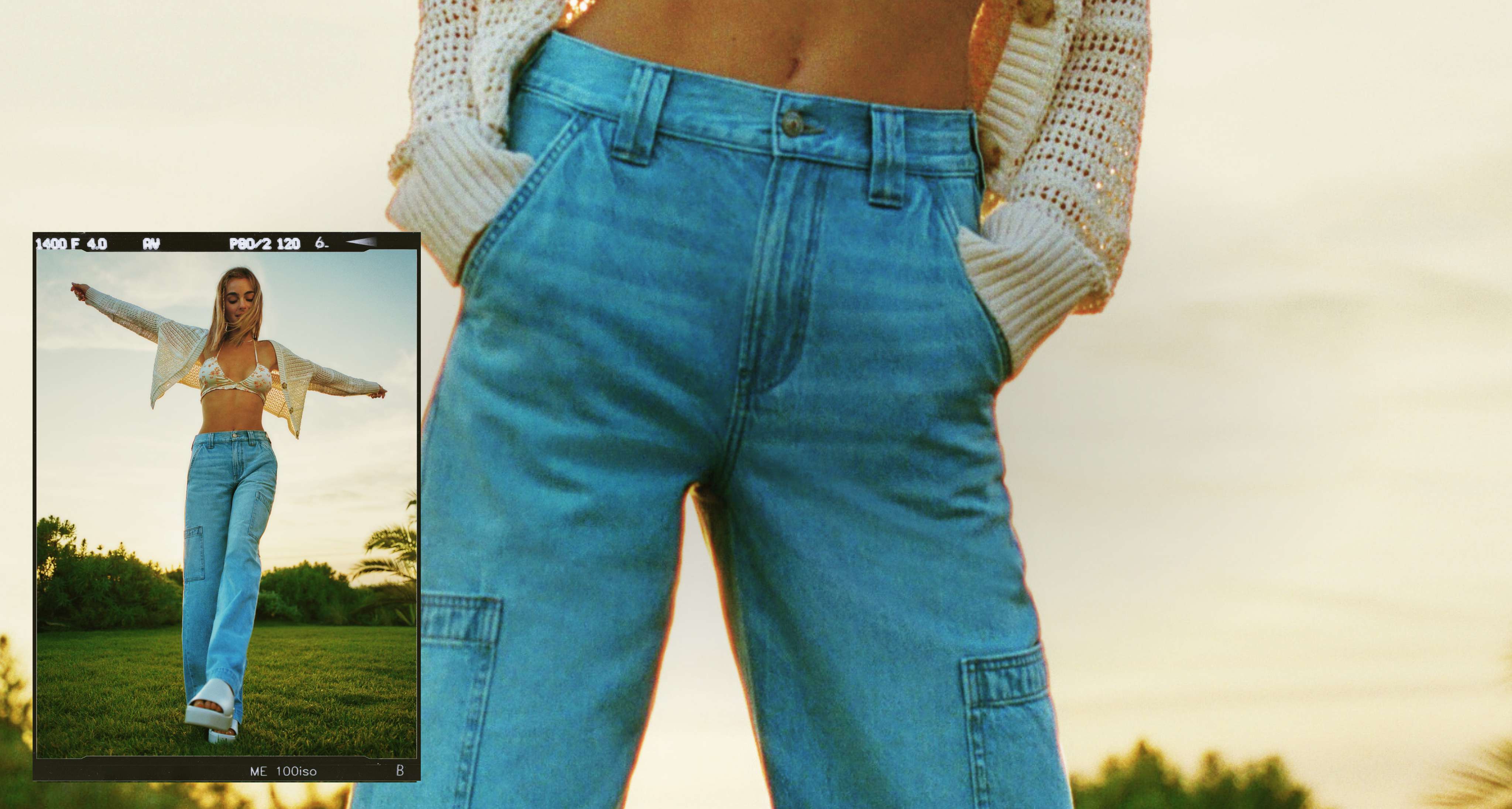 model in grassy field wearing AE jeans