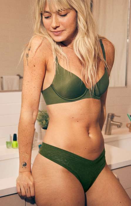 model in green aerie bra and thong