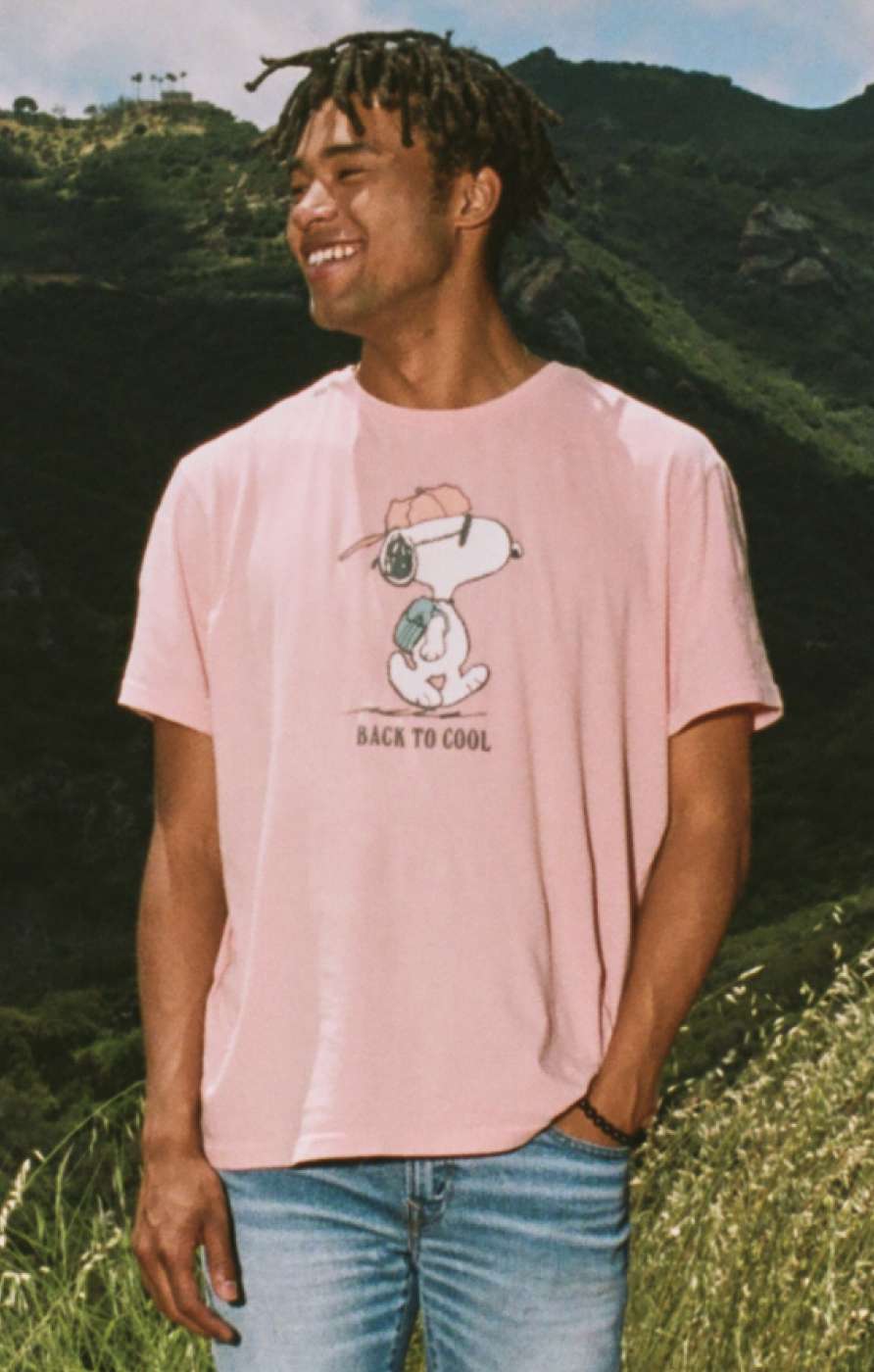 Model in pink graphic tee