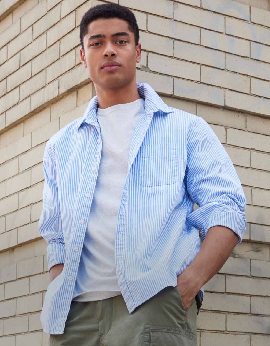 Model in long sleeve button-up