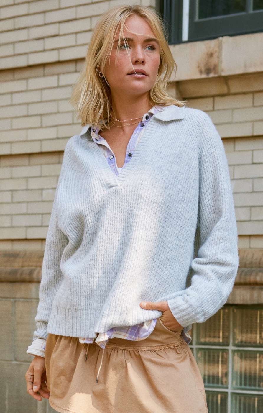 Model in knit pullover