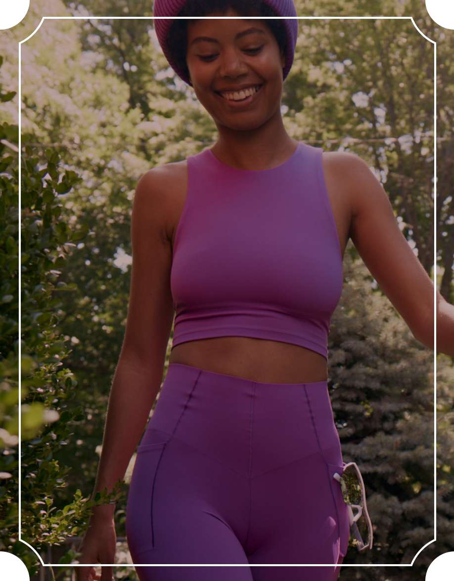 Model in matching purple workout set 