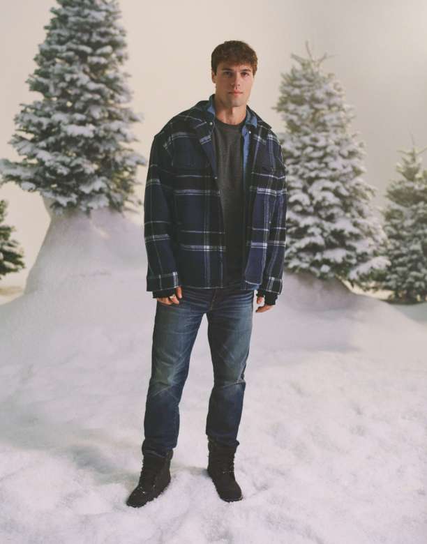 model in jeans in the snow