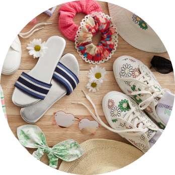 laydown of accessories including shoes hats and scrunchies 