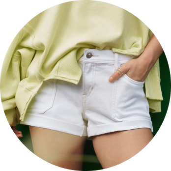 cropped shot of model in white shorts 