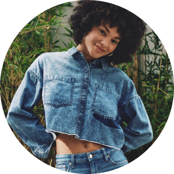 model wearing denim cropped long sleeve top