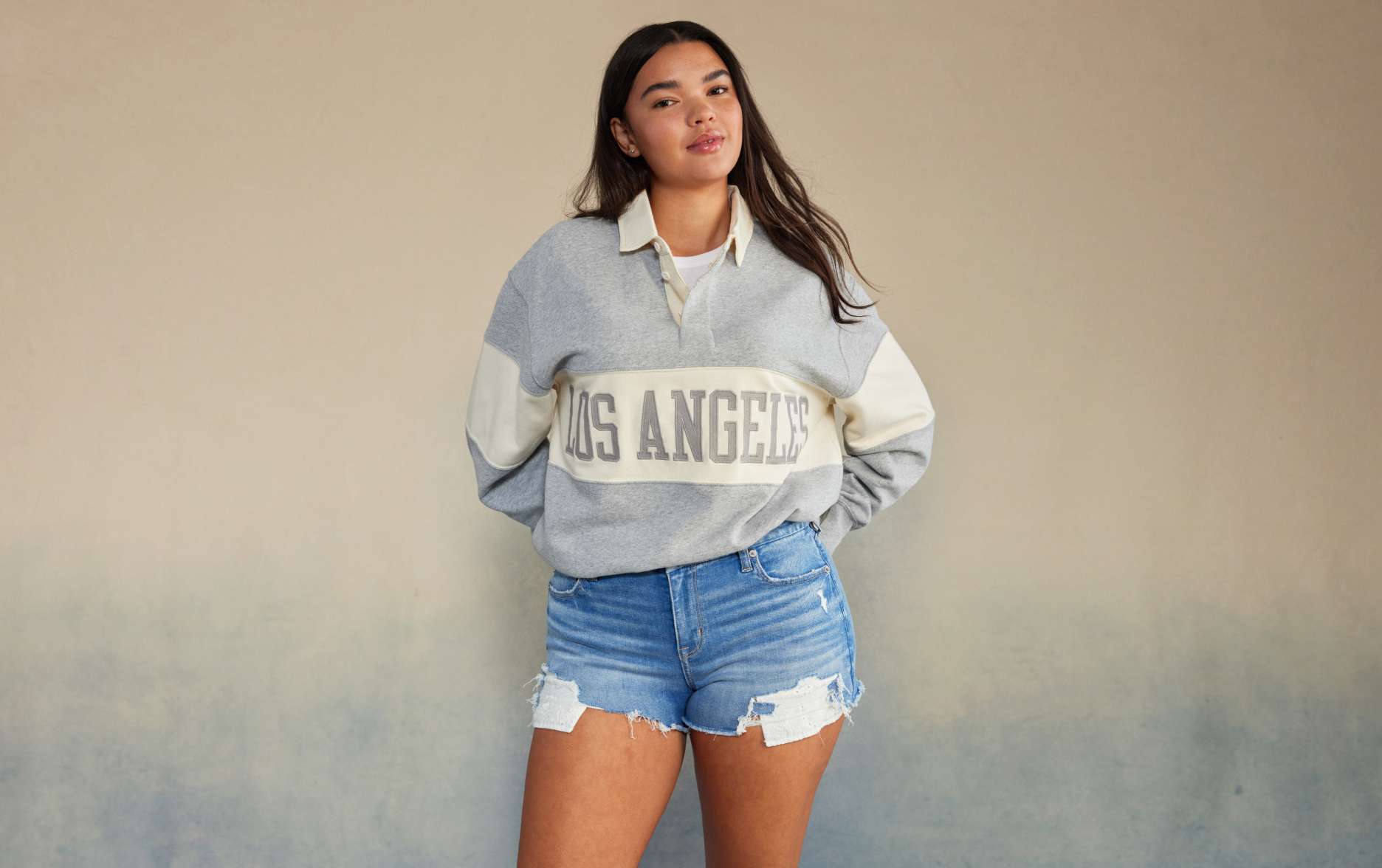model in denim shorts and los angeles pull over